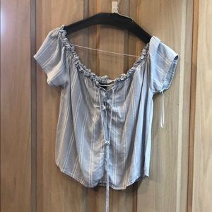 A blue and white striped flowy shirt